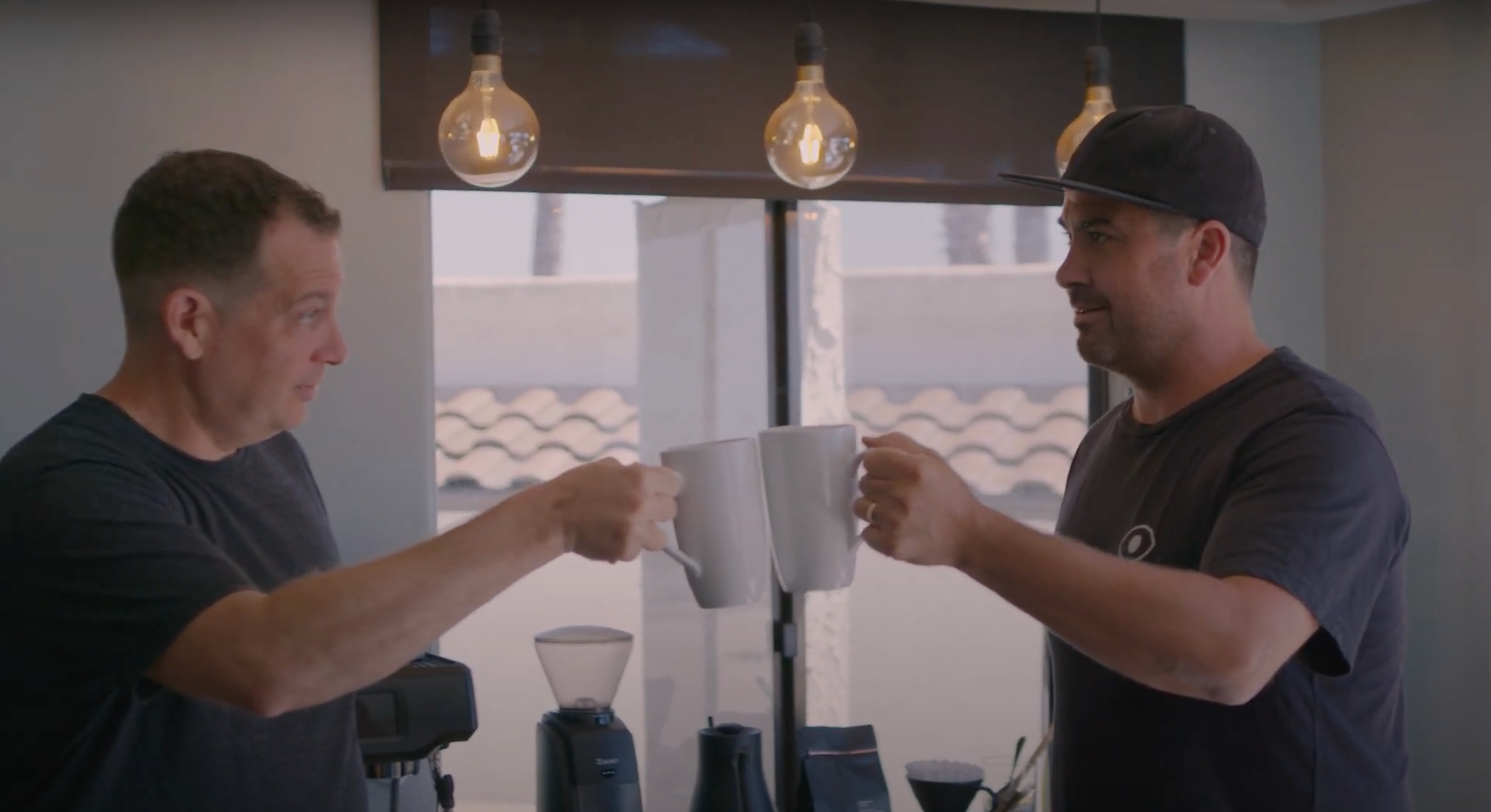 2 men enjoying cup of single origin coffee