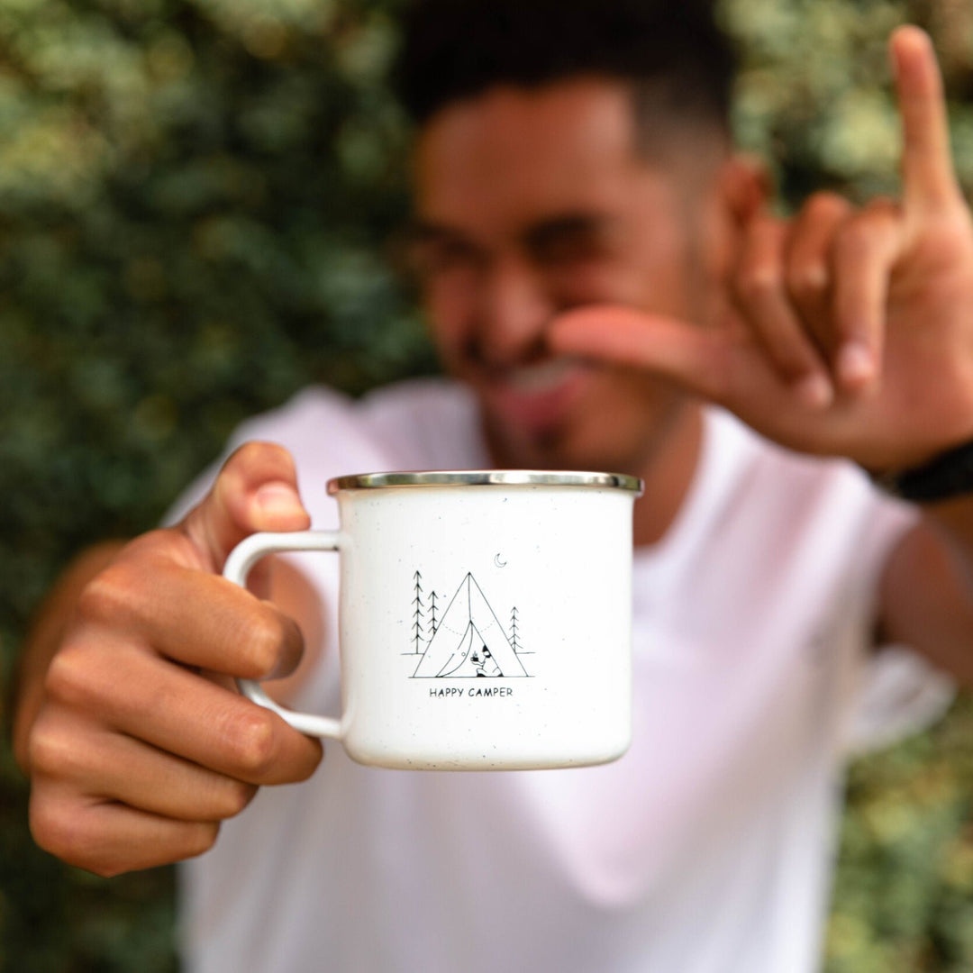 HAPPY CAMPER ENAMEL MUG HELD BY A MAN